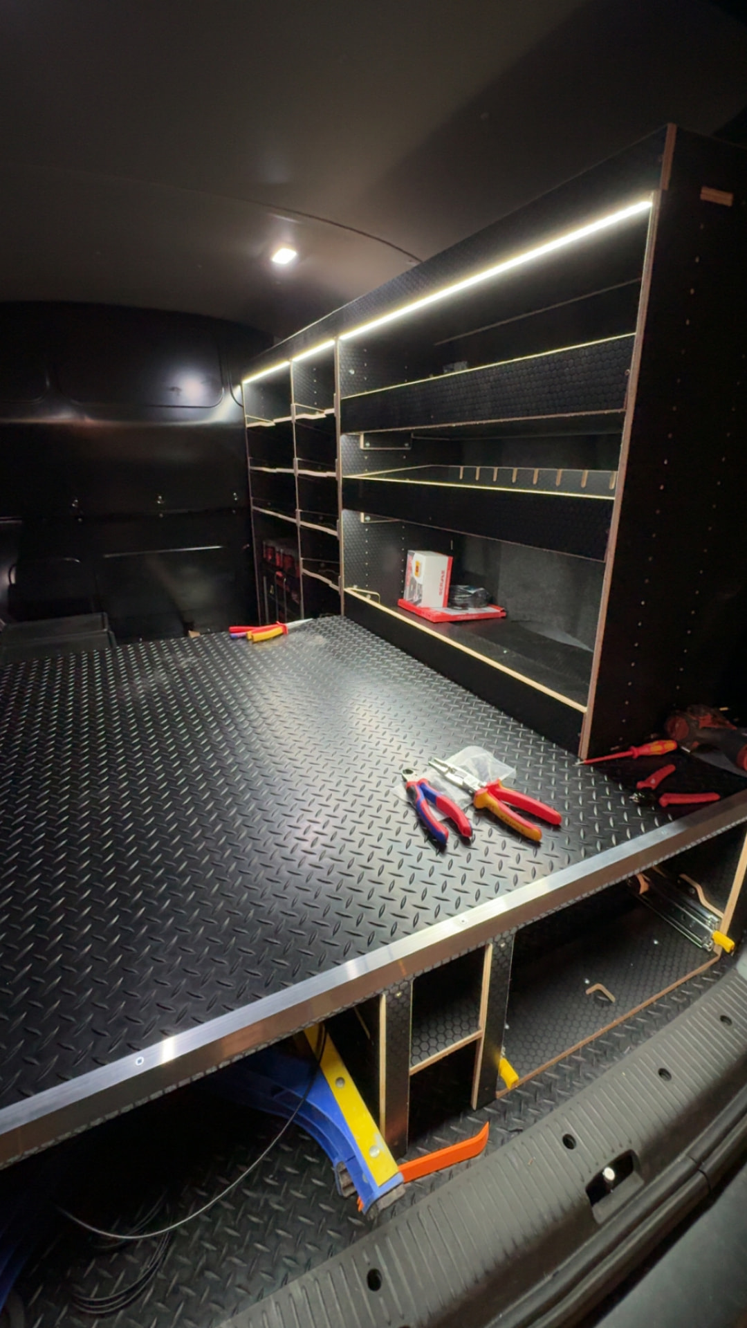 Heavy duty rubber van flooring installed in a commercial van load area